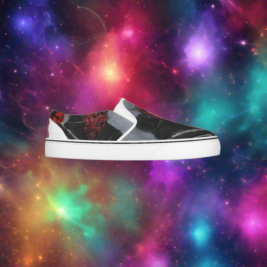 Black and white slip-on sneaker with red accents on a white background