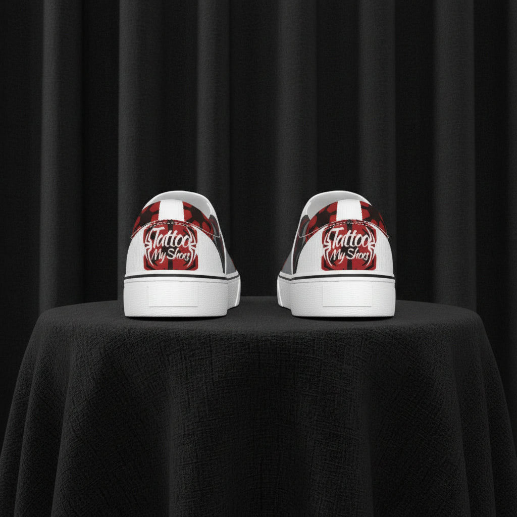 White sneakers with red and black designs on a white background