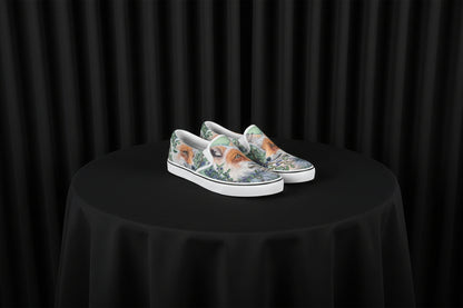 Pair of slip-on shoes with fox design on a white background