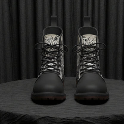 Pair of black and gray patterned boots on a white background