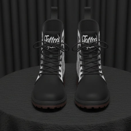 Black and white boots with 'Tattoo' branding on a white background