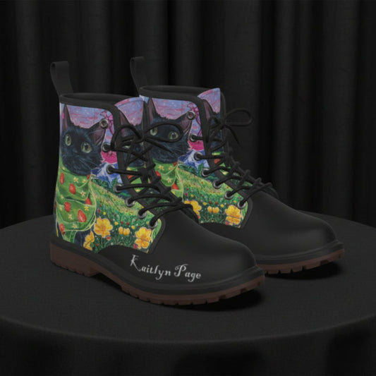 Black boots with artistic cat design on a white background