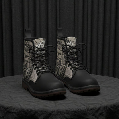 Black boots with intricate design on a white background