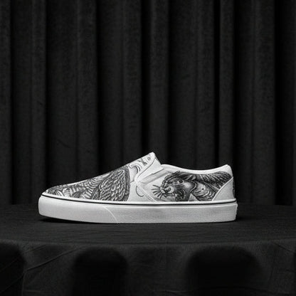 White slip-on sneaker with black and white tiger design on a white background