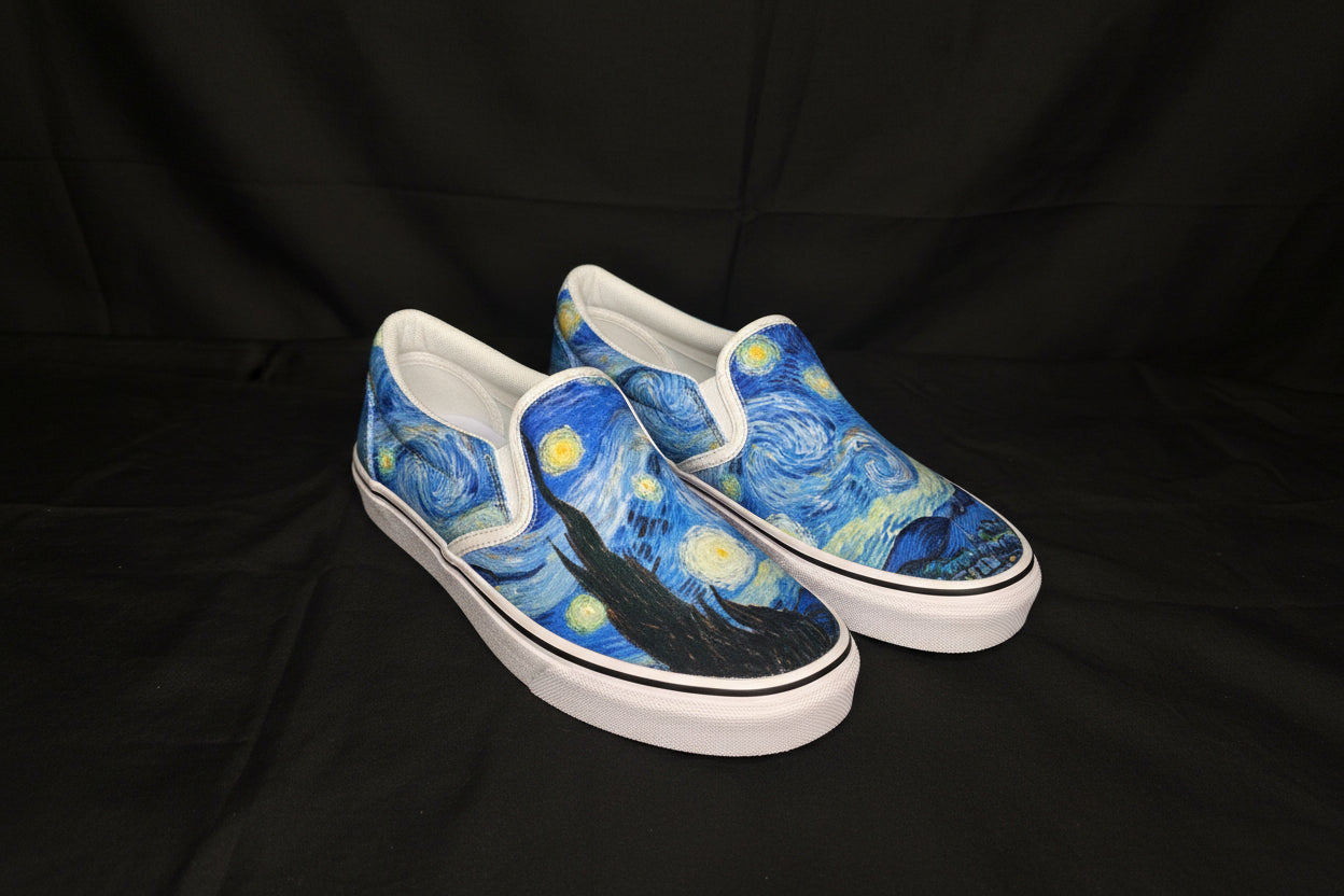 Pair of slip-on shoes with Starry Night design on a black background