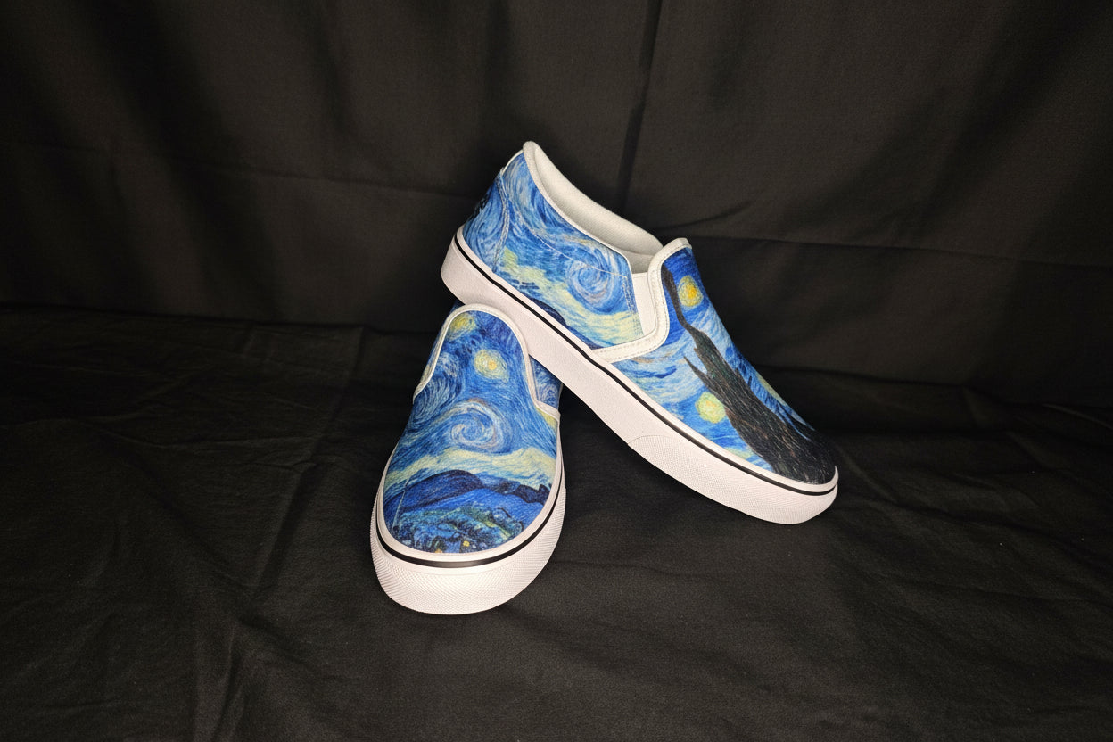 Pair of slip-on shoes with Starry Night design on a black background