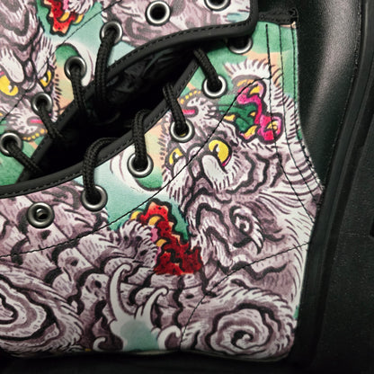 Close-up of a shoe with a colorful tattoo-style pattern on the side.