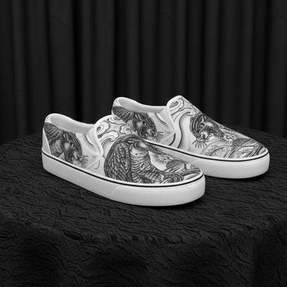 Silver slip-on shoes with intricate designs on a white background