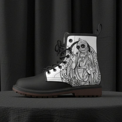 Black boot with intricate white design on a white background
