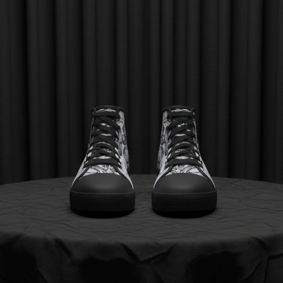 Pair of high-top sneakers with black and gray pattern on a white background