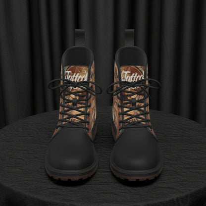 Pair of black and brown patterned boots on a white background