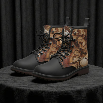 Pair of black boots with patterned side panels on a white background