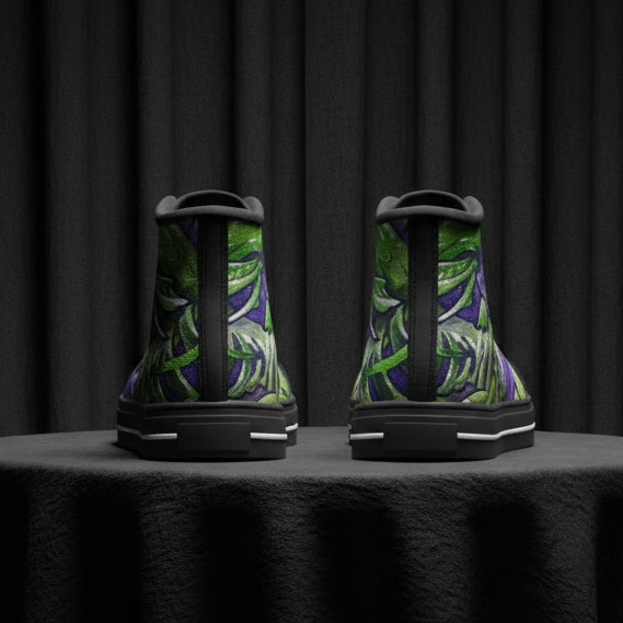 Pair of high-top sneakers with green leaf pattern on a white background