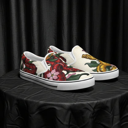 Pair of loafers with floral and Snake design on a white background