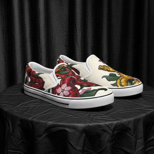 Pair of loafers with floral and Snake design on a white background